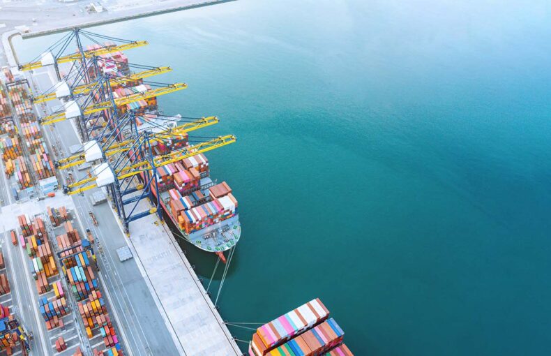 Aerial top view of Container ship loading and unloading in port
